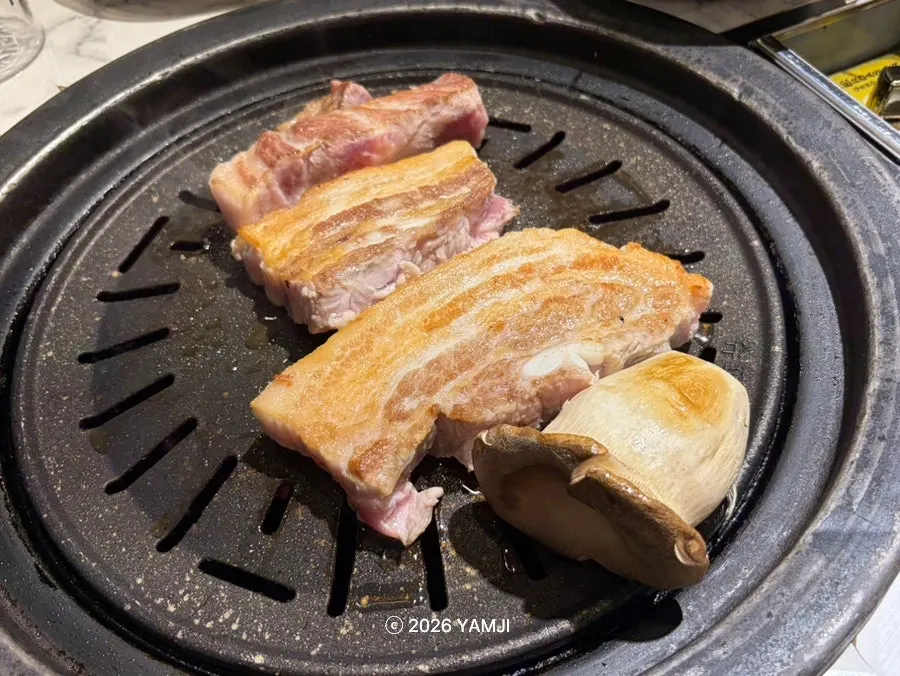 Pork platter grilling on the grill