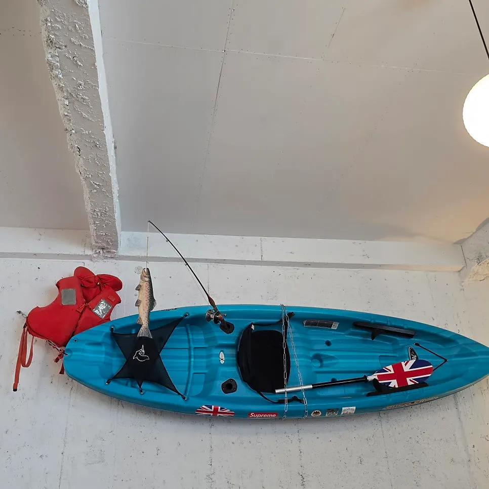 Boat ornament on a white wall