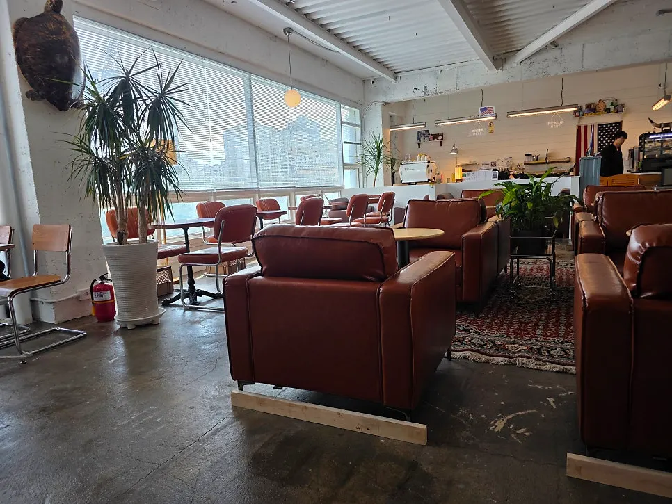 Café interior with brown tones and woody tables