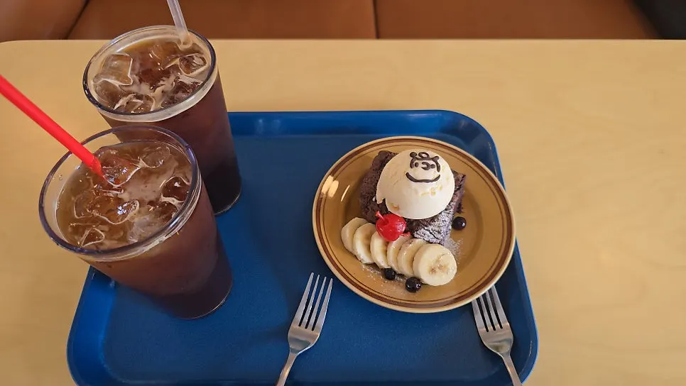 Dessert with a Charlie Brown drawing in chocolate pen