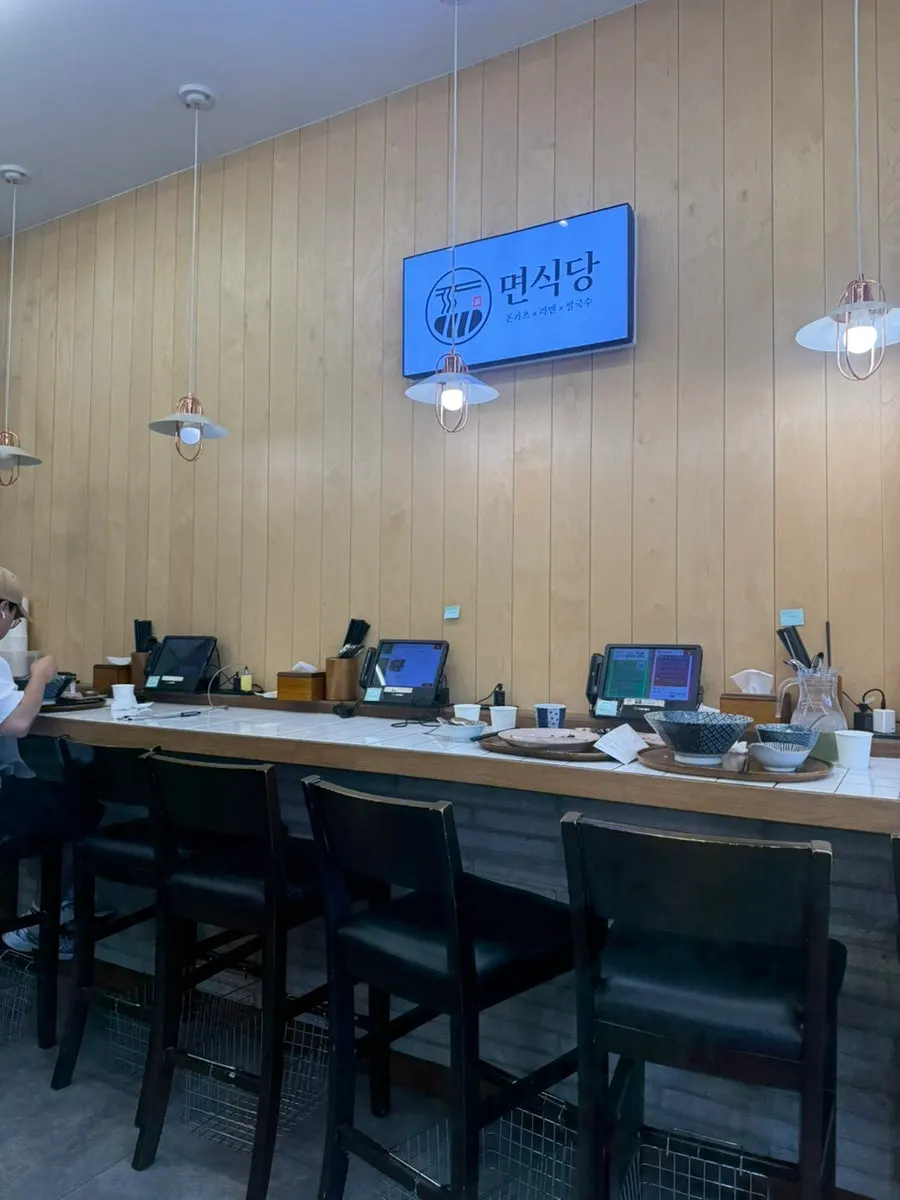 Bar seats along the wall for solo diners