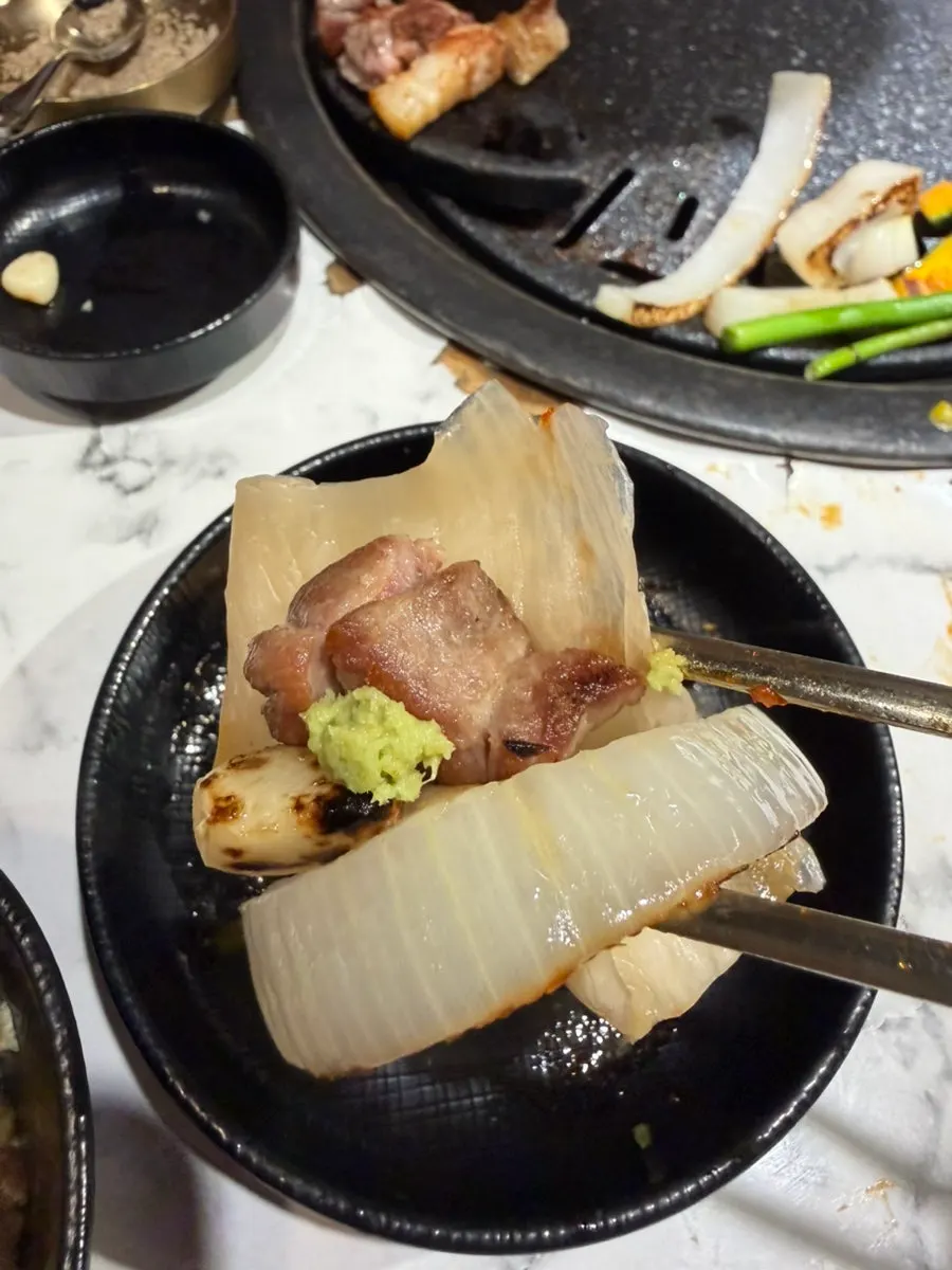 Grilled meat wrapped in baek kimchi