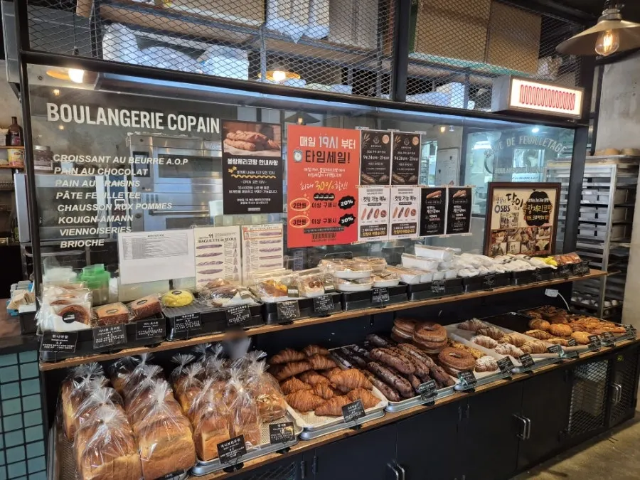 Inside Boulangerie Copain with bread displayed on shelves