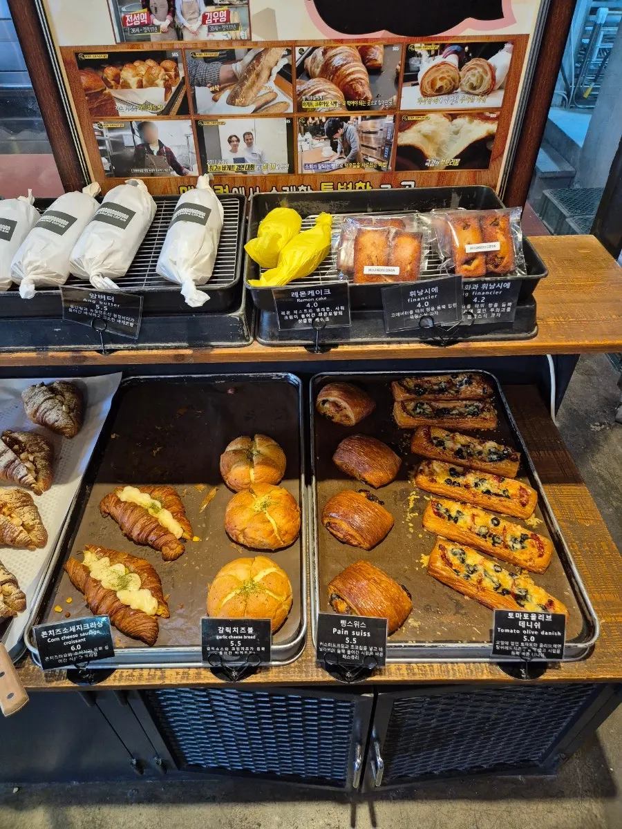 Display of ham cheese baguette sandwich and croissants