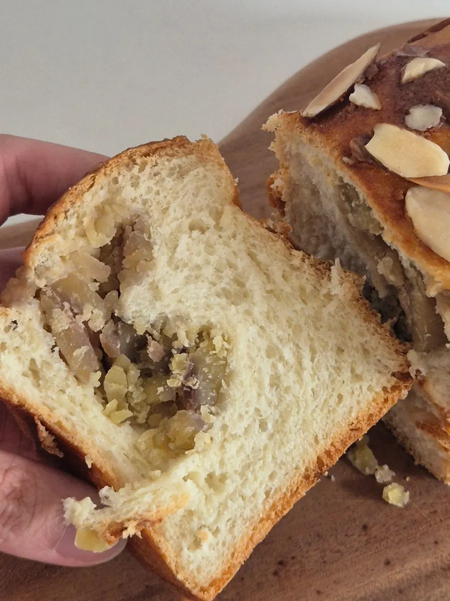 Almond-topped exterior of the chestnut bread