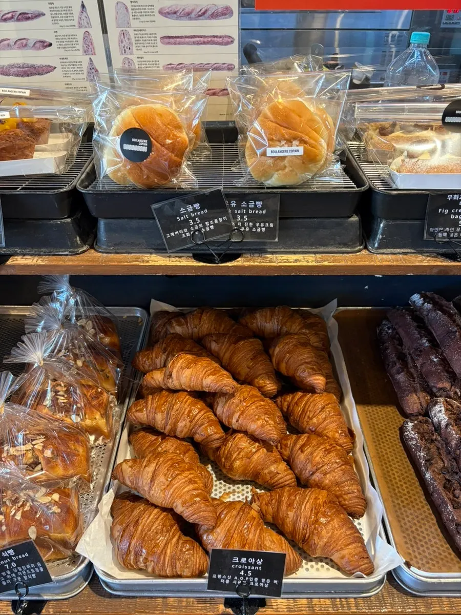 A display case with various baguettes