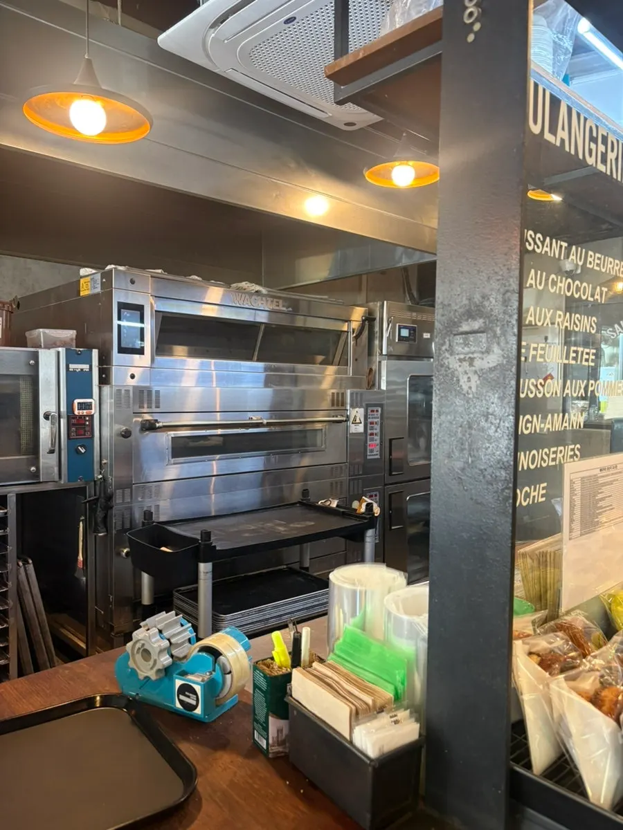 Counter with menu and price information at Boulangerie Copain