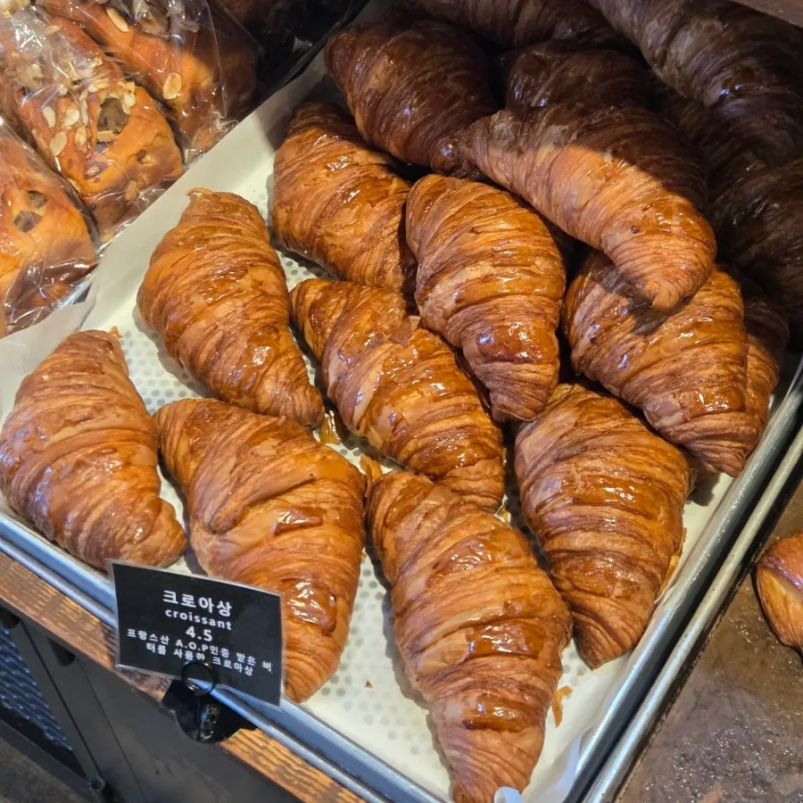 Baguettes and croissants displayed at Boulangerie Copain