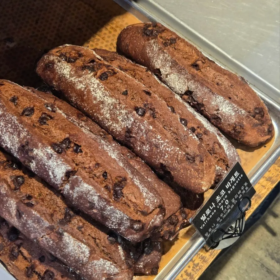 Display shelf with the signature Valrhona chocolate baguette