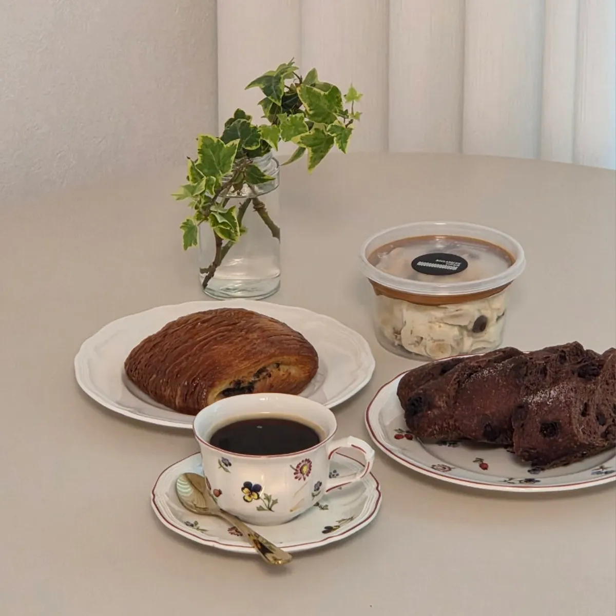 Bread on a plate with a cup of coffee