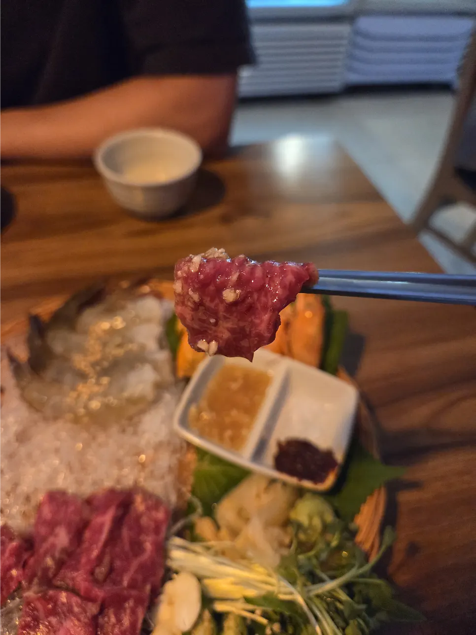 The beef sashimi and raw shrimp combination