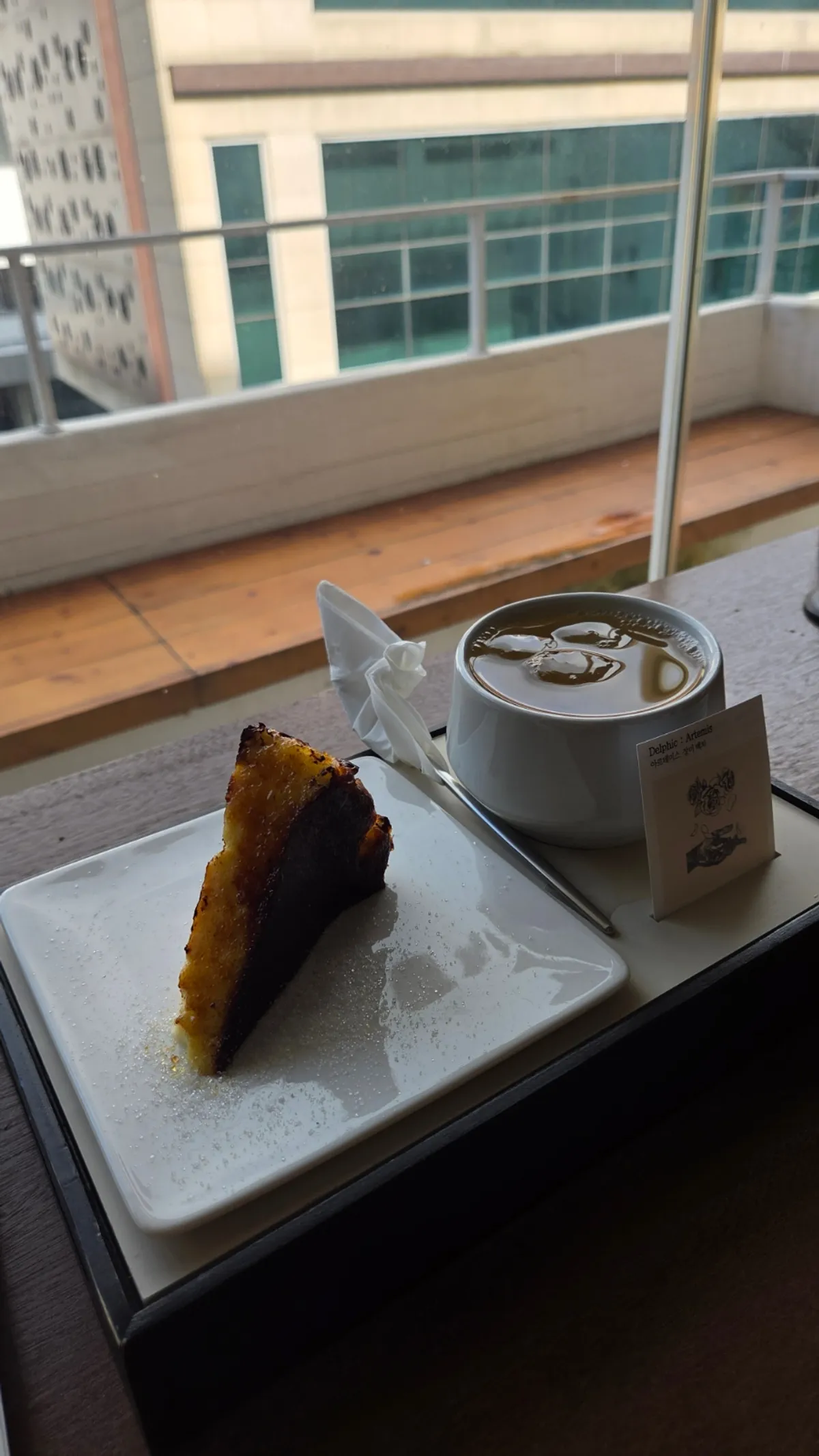 Table by the window enjoying tea and dessert
