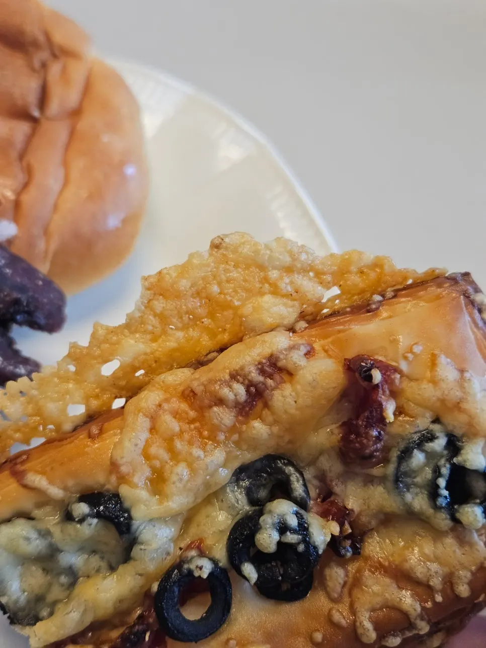 Tomato olive Danish cross-section and cheese