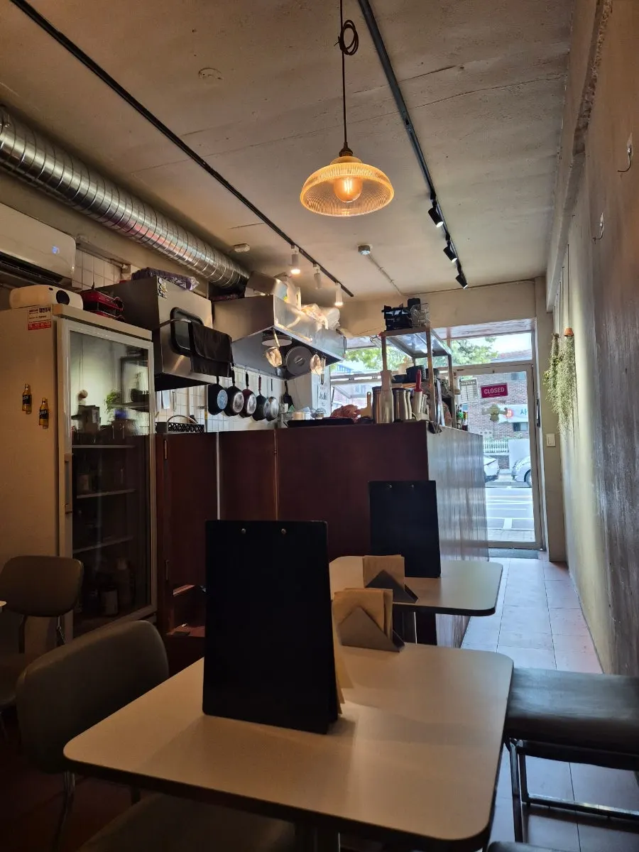 Macho Nacho's interior with the open kitchen and drinks on display