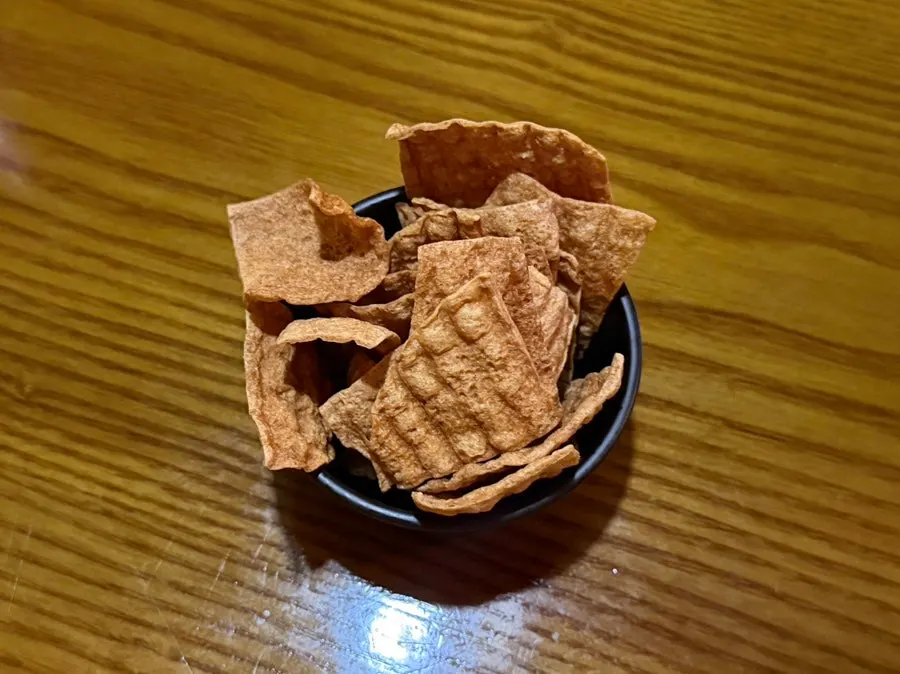 Complimentary dried fish chips snack