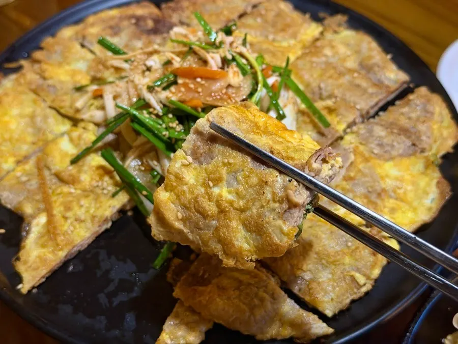 A thick piece of yukjeon coated in egg