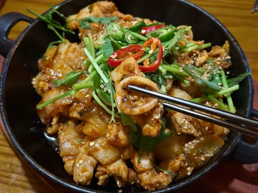 Close-up of squid pork belly stir-fry with spicy-sweet sauce