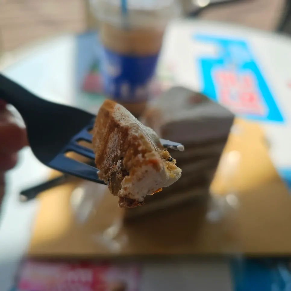 Carrot cake cut with a fork