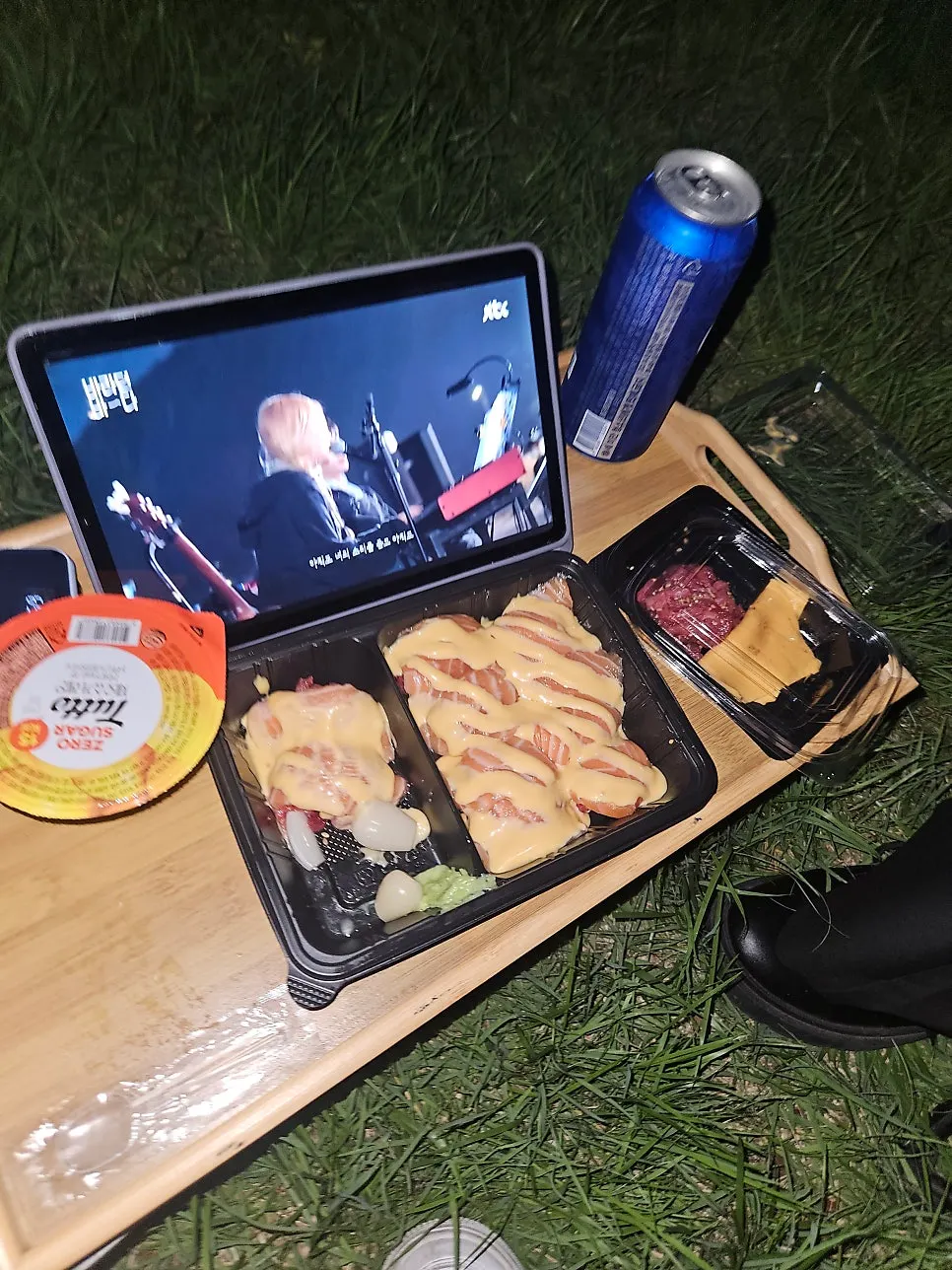Camping chairs and table set up at the Han River park at night