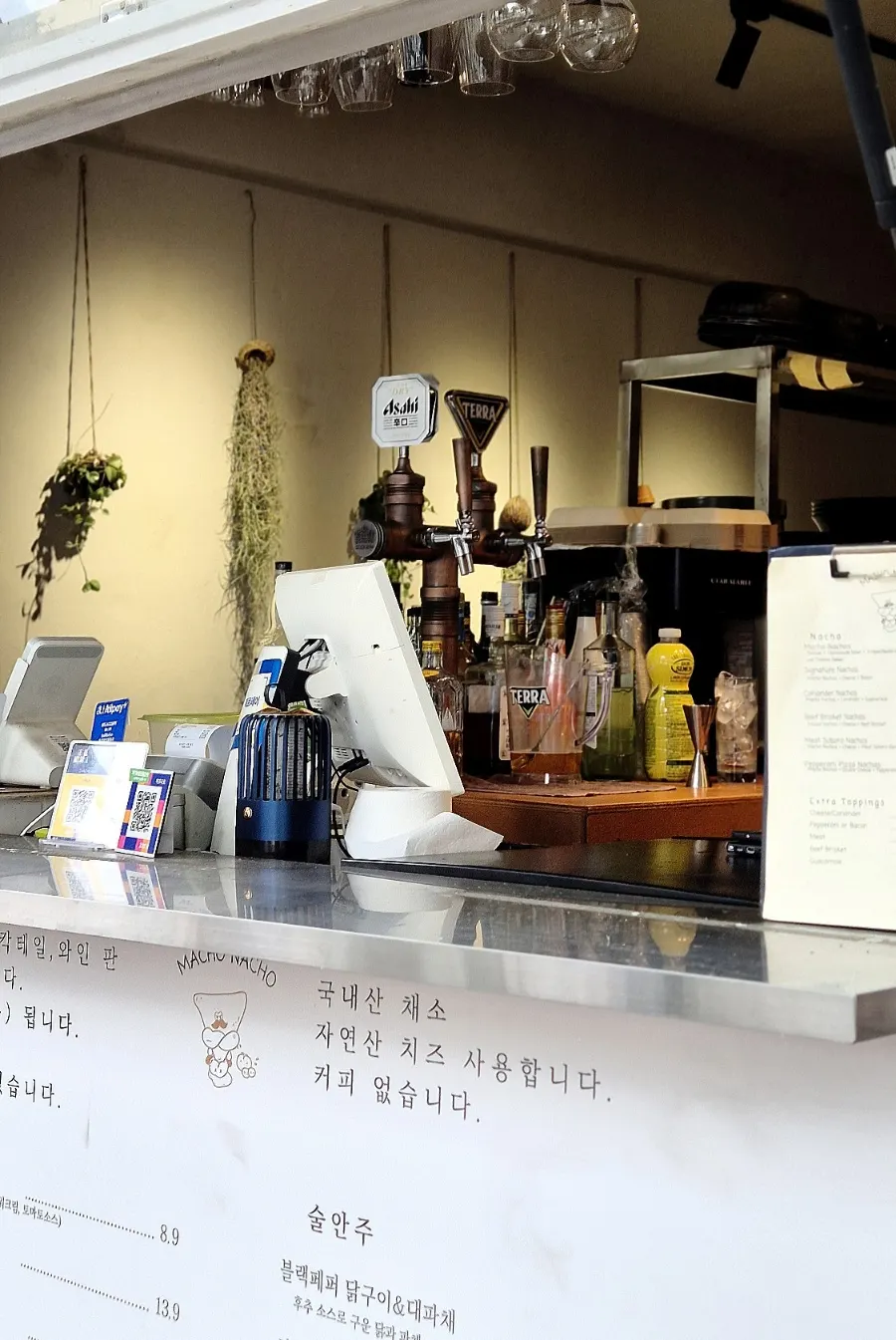 Draft beer, highballs, and wine set up inside Macho Nacho