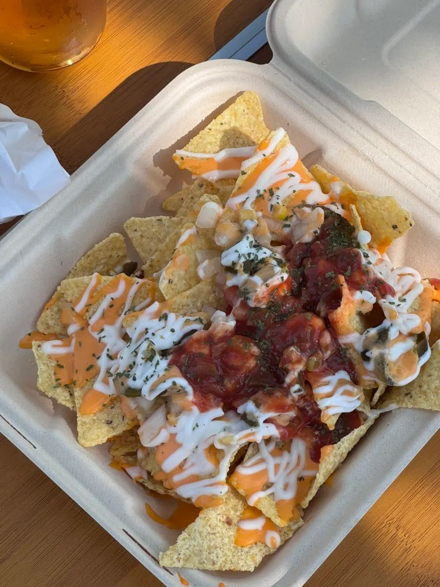 Nachos and draft beer set up on a table at Mangwon Hangang Park