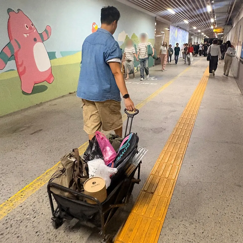 A friend loading picnic gear onto a wagon