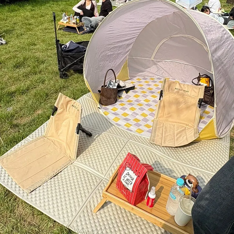 Picnic spot with both shade tent and mat set up