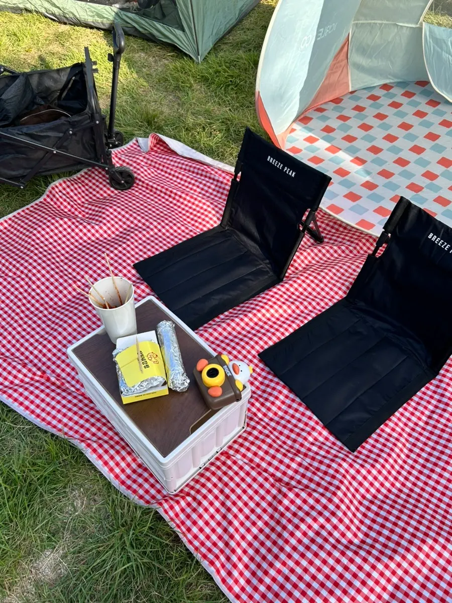 Red checkered mat and wood table set up at Mangwon Hangang Park