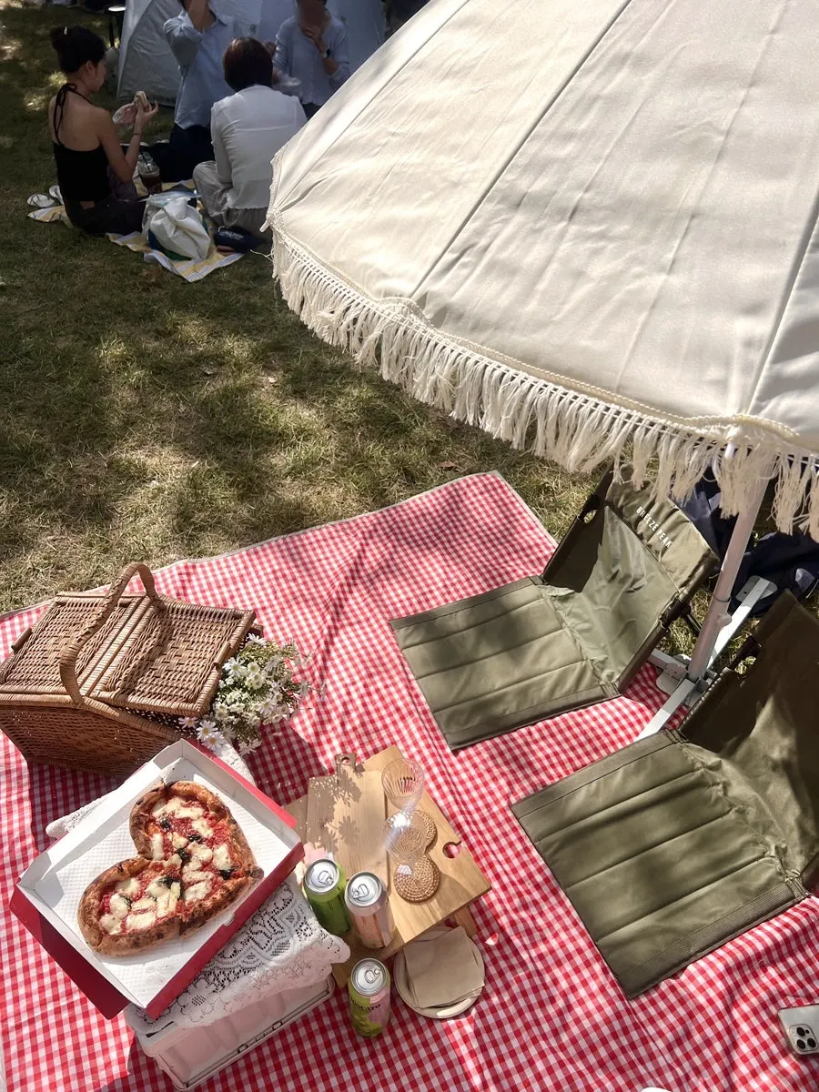 Rental parasol shading the picnic spot