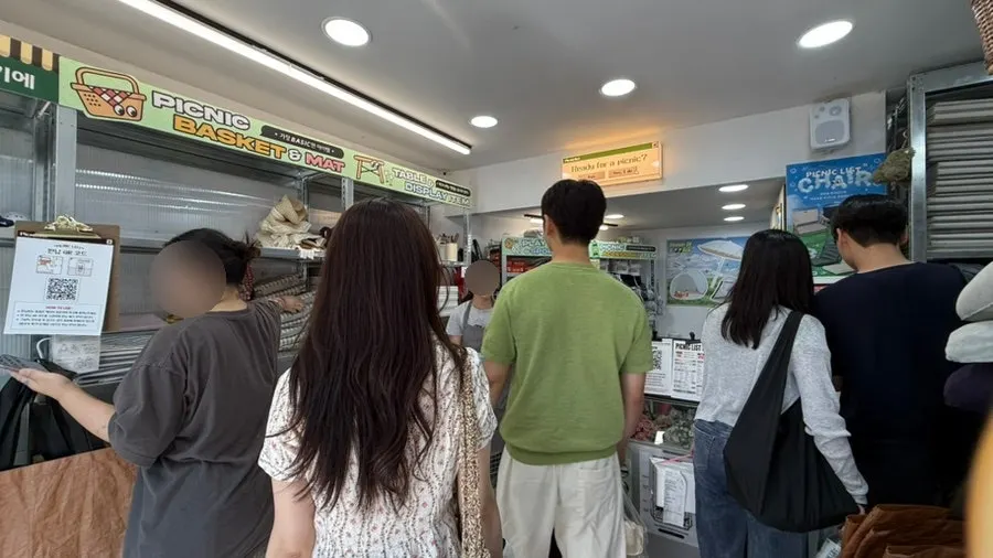 Store interior crowded with rental customers on a Sunday afternoon