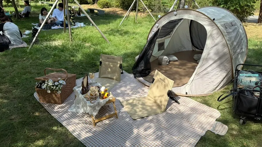 Han River picnic spot set up with a one-touch tent