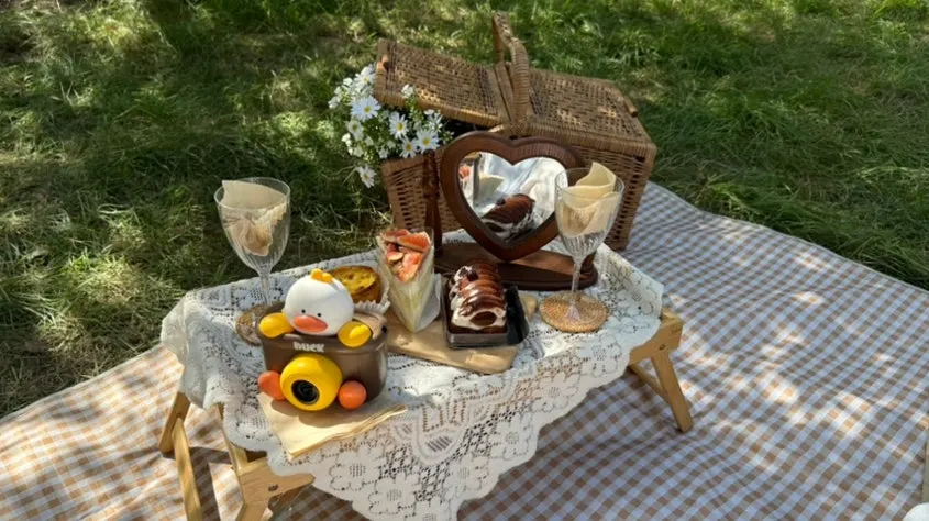 Picnic spread set with a wood table and wood tableware