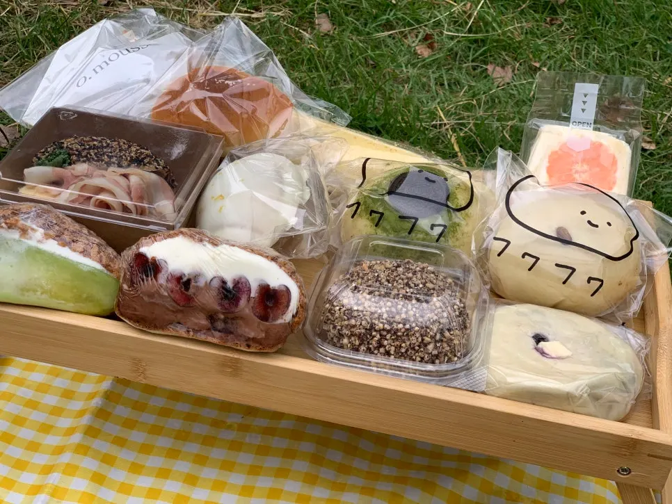 Picnic spread with Mangwon Market dakgangjeong, cup wine, and bread