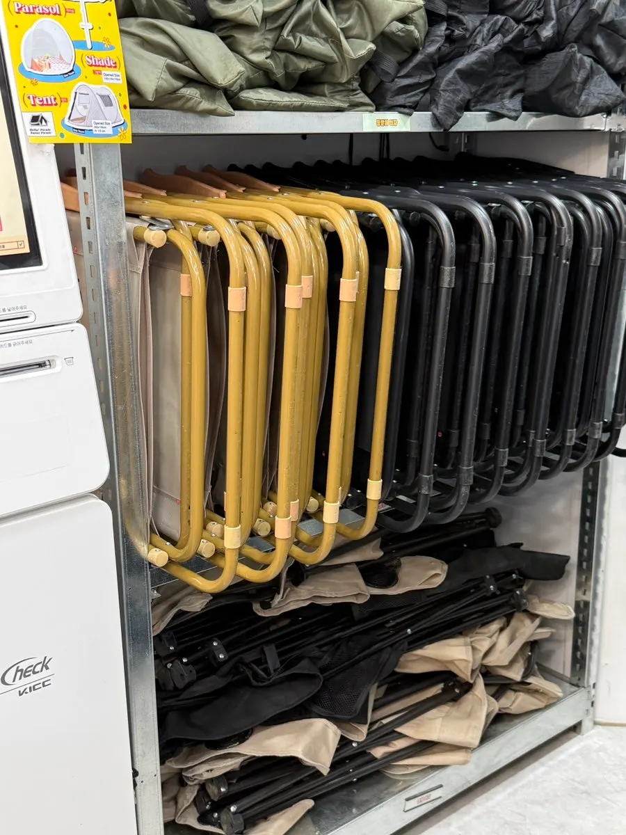 Neatly organized shelf of picnic rental gear