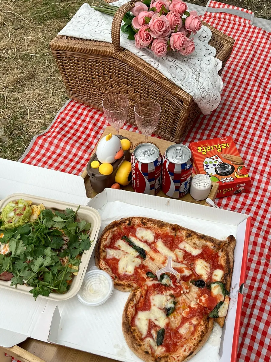 Picnic styling with a rattan basket and blanket