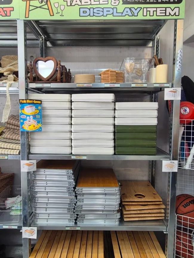 Picnic rental items neatly organized on labeled shelves