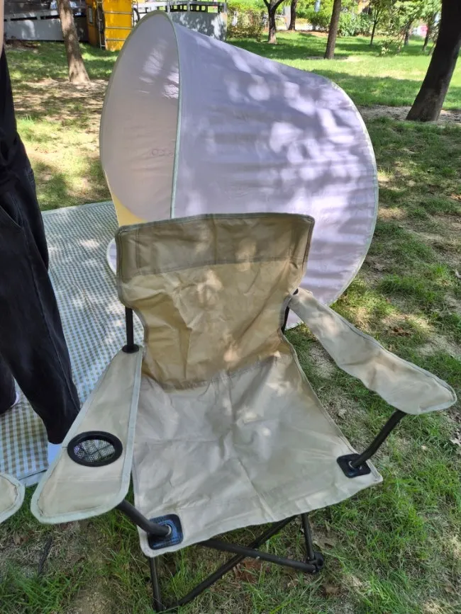Mat and tent set up as a picnic spot at Mangwon Han River Park