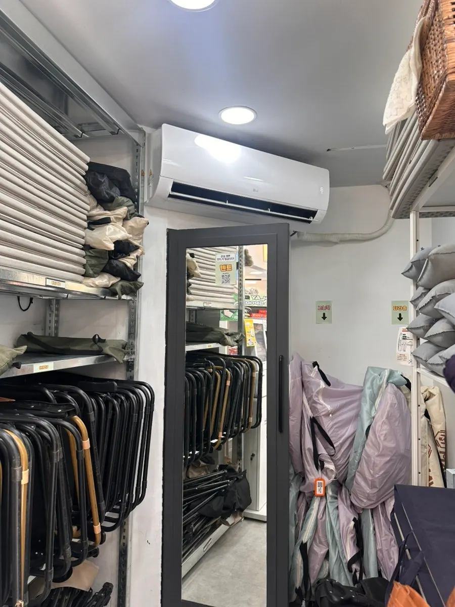 Display shelf with Bluetooth speakers and other rental items