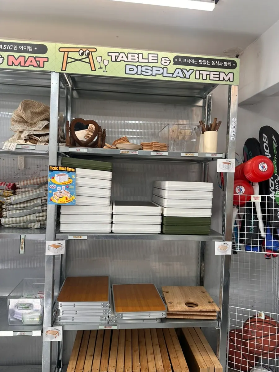Shelf with footballs and other play items in the store