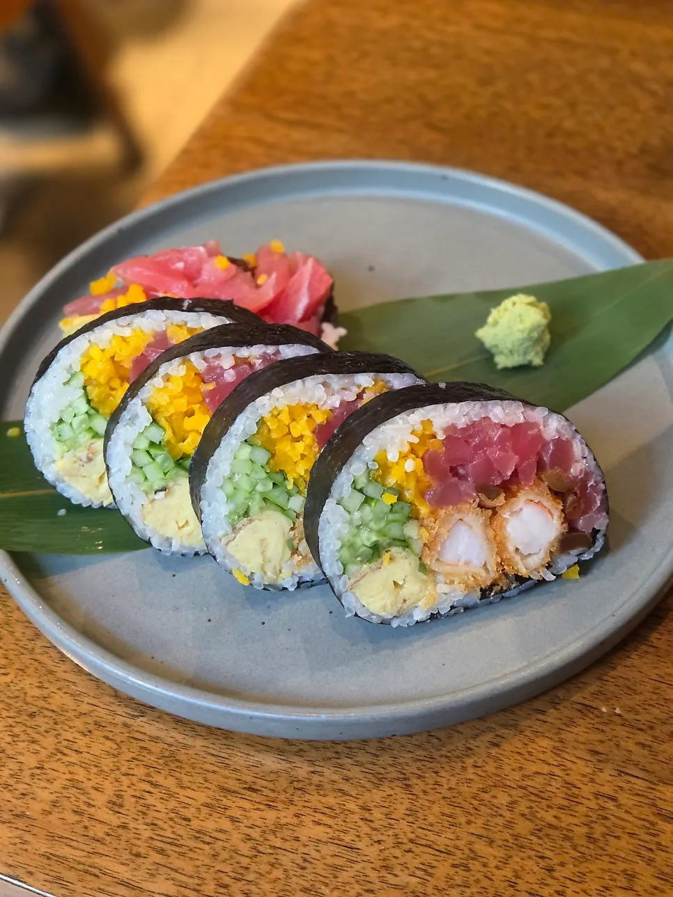 Cross-section of futomaki with tuna, salmon, and fried shrimp