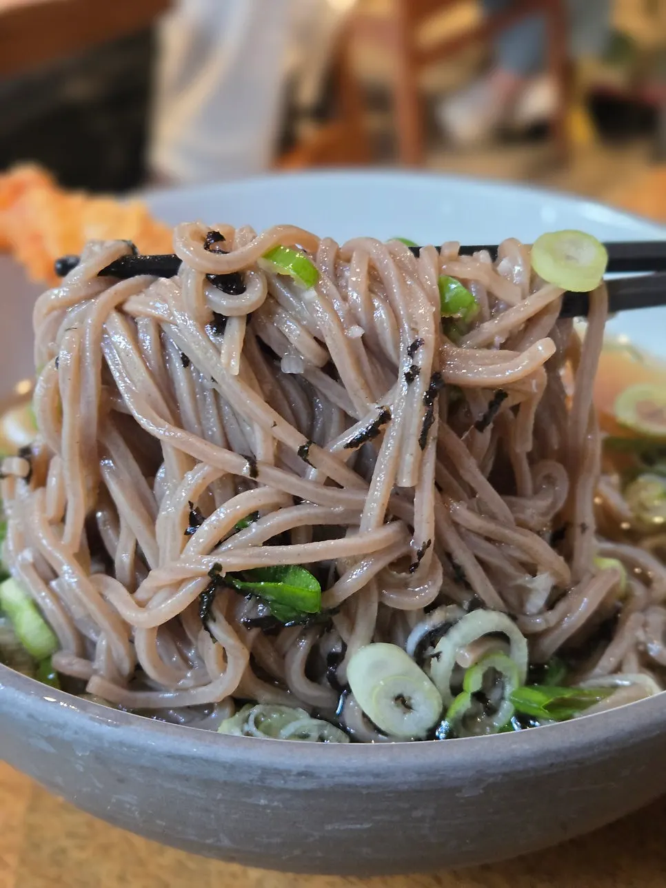 A bowl of cold soba with a generous noodle portion