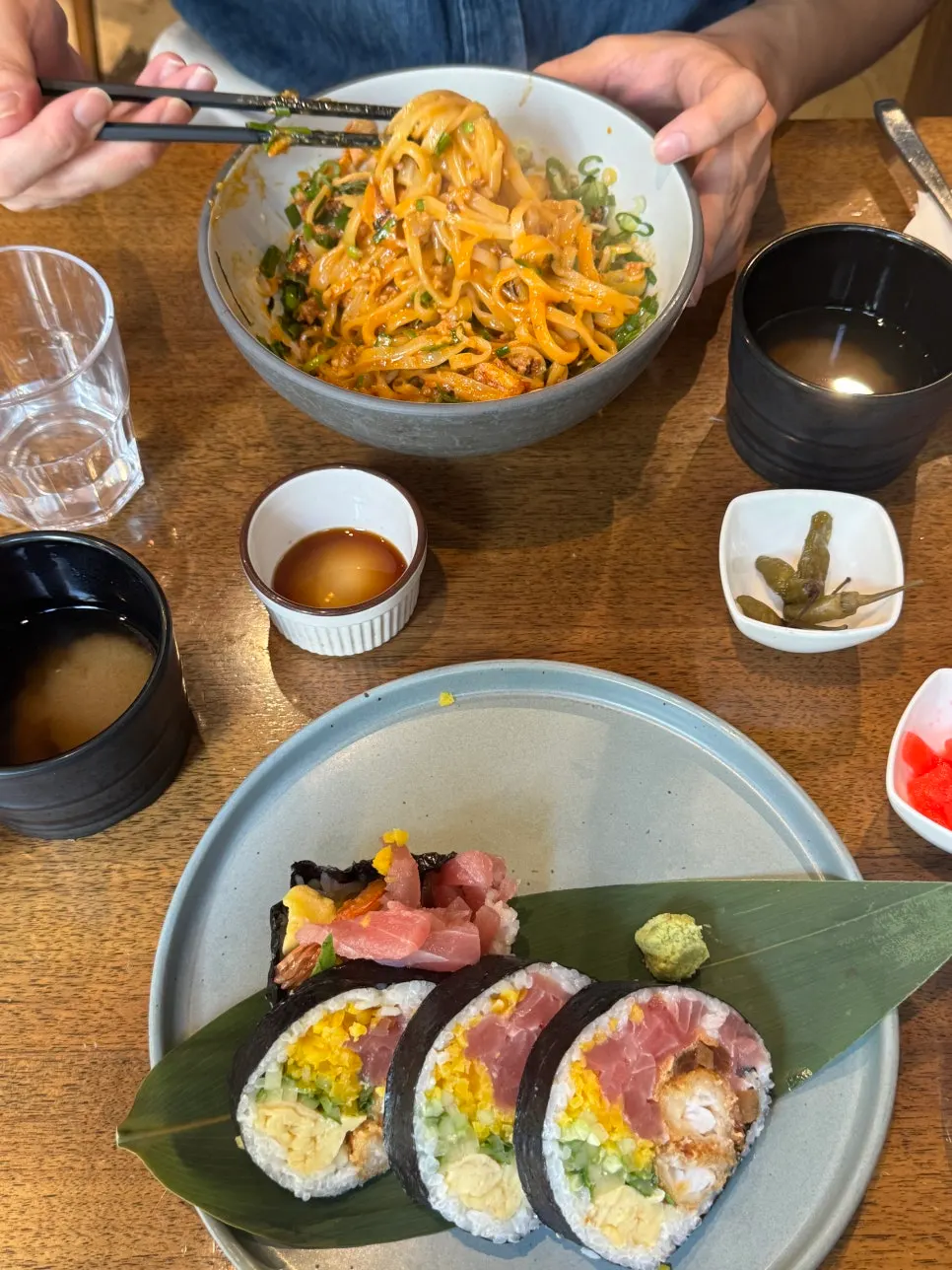 Futomaki and mazesoba laid out on the table at Padong