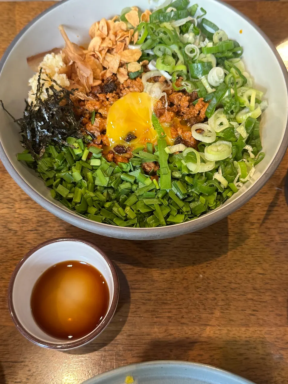 A generous bite of Padong's futomaki being picked up
