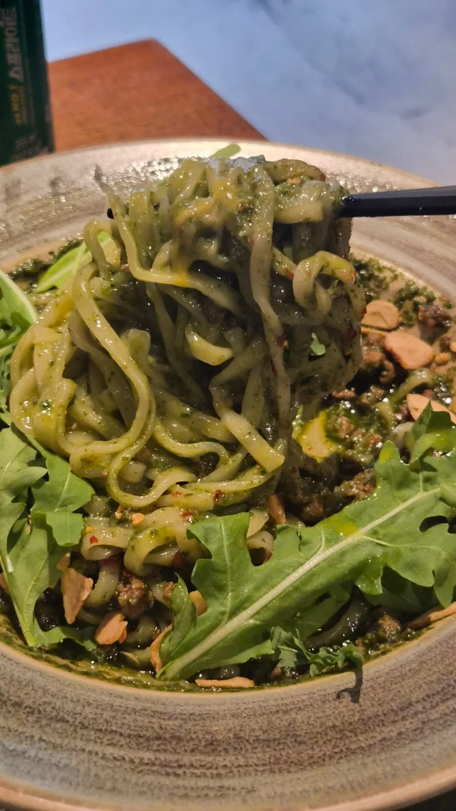 Basil soba noodles being mixed