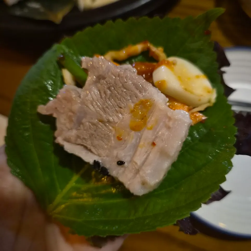 Bossam served with tofu and shredded radish salad