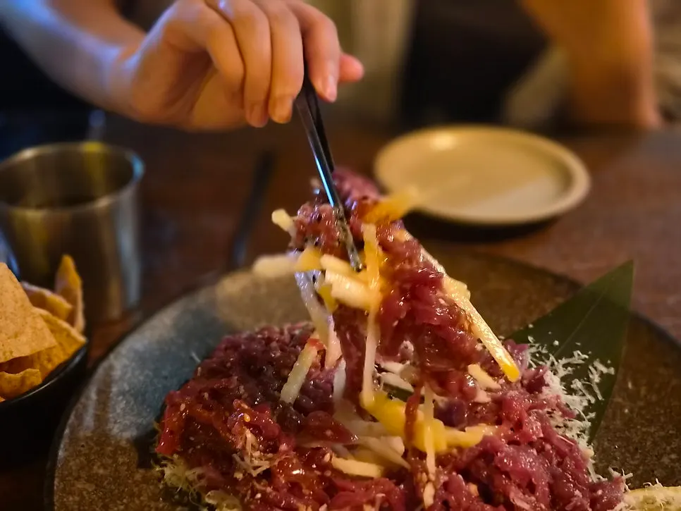 Close-up of hanwoo yukhoe topped with cheese