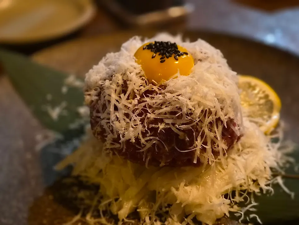 Plate of hanwoo cheese yukhoe nearly finished