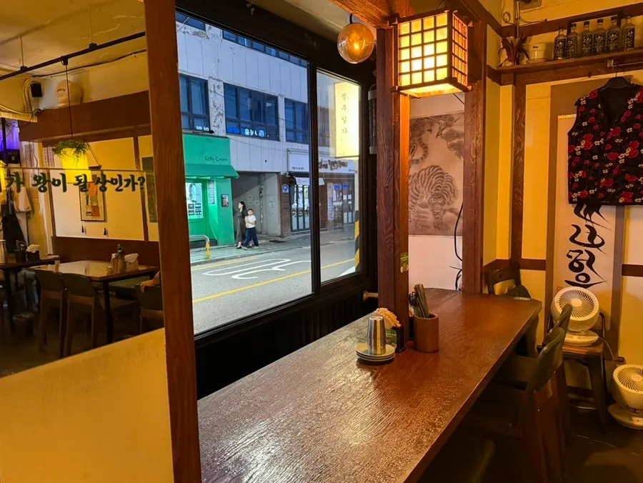 Interior of Jeongju Ilga's dining hall hung with traditional paintings