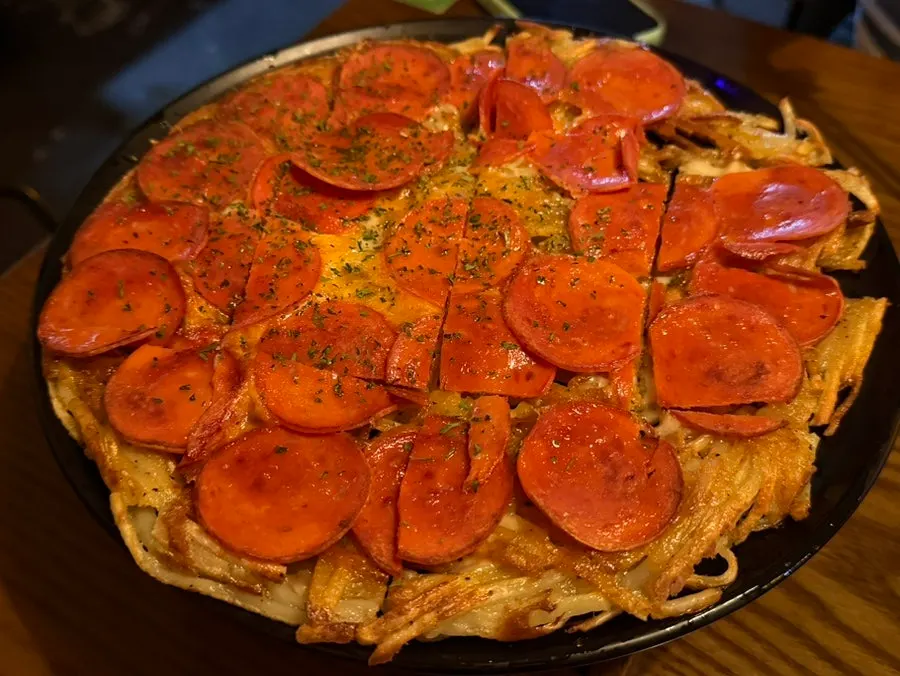 Table spread of dakmuchim and pepperoni potato pancake