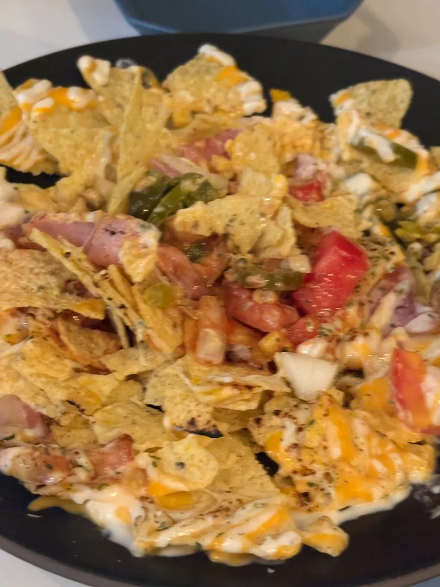 Crushing cheese-topped nachos together